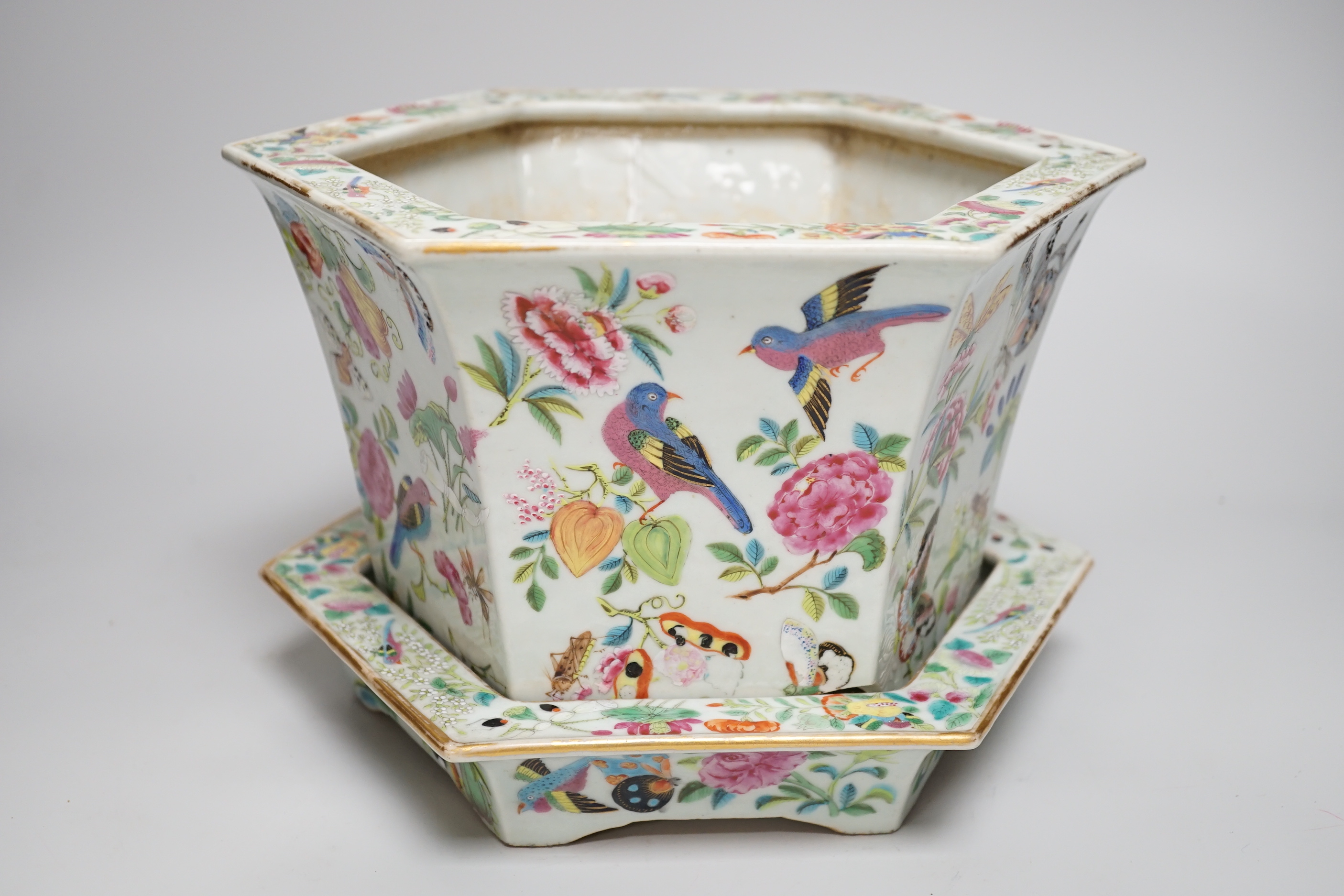 A 19th century Chinese Canton decorated famille rose hexagonal planter a/f and stand, 18.5cm high